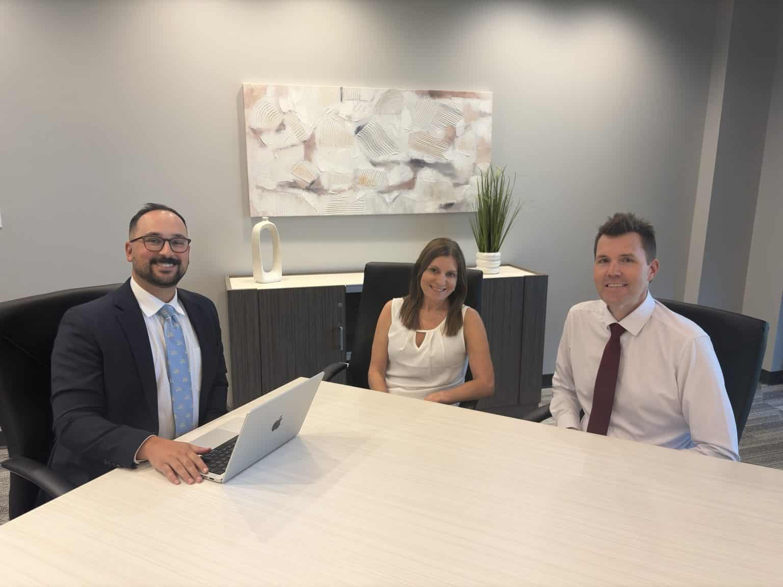 Sotiriou Wilmowski Injury Law attorneys at conference table, St. Louis